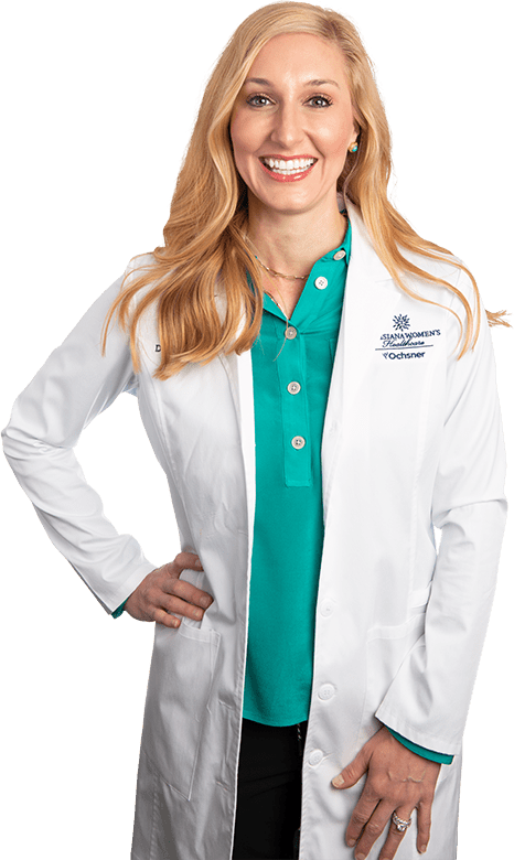 Photo of Dr. Allyson Boudreaux standing and smiling in white lab coat
