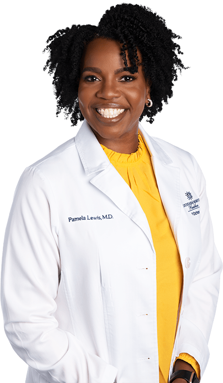 Photo of Dr. Pamela Lewis standing and smiling in white lab coat