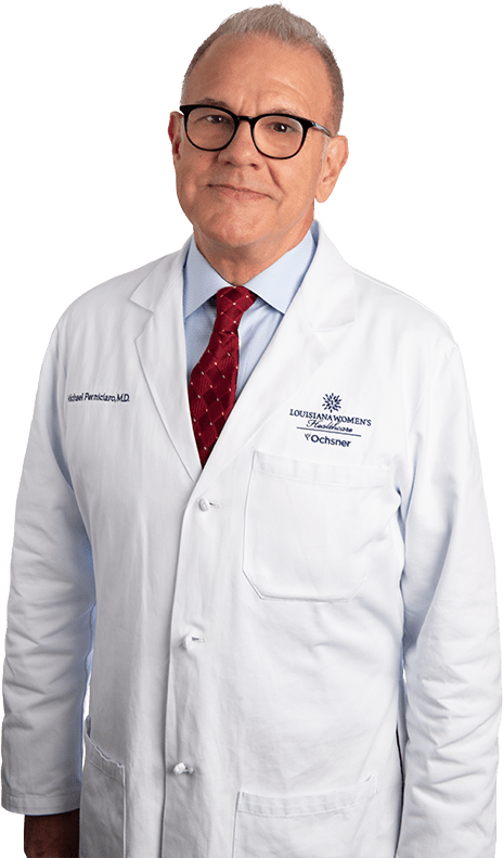 Photo of Dr. Michael Perniciaro standing in white lab coat